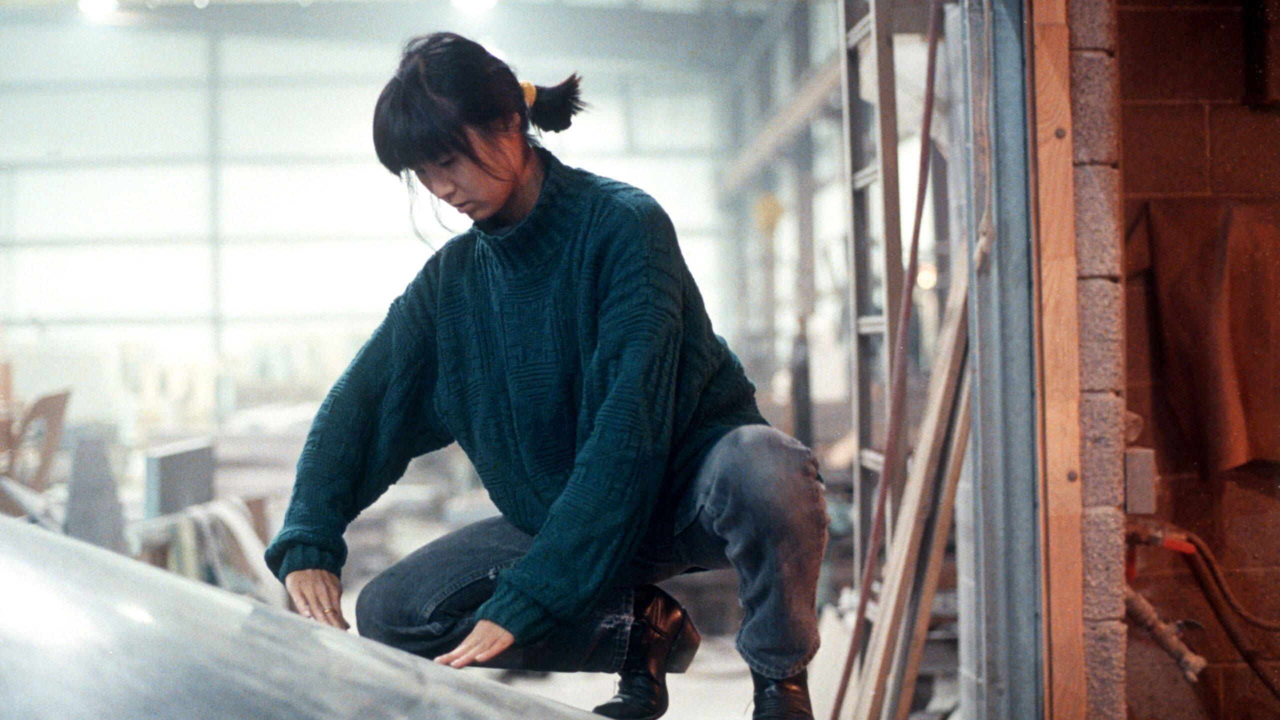 A photo of Maya Lin creating a piece of art