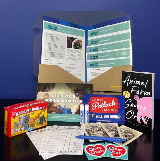 Unmuzzled Book Club in a Box with animal crackers, Animal Farm book, and PBS Utah and PBS swag