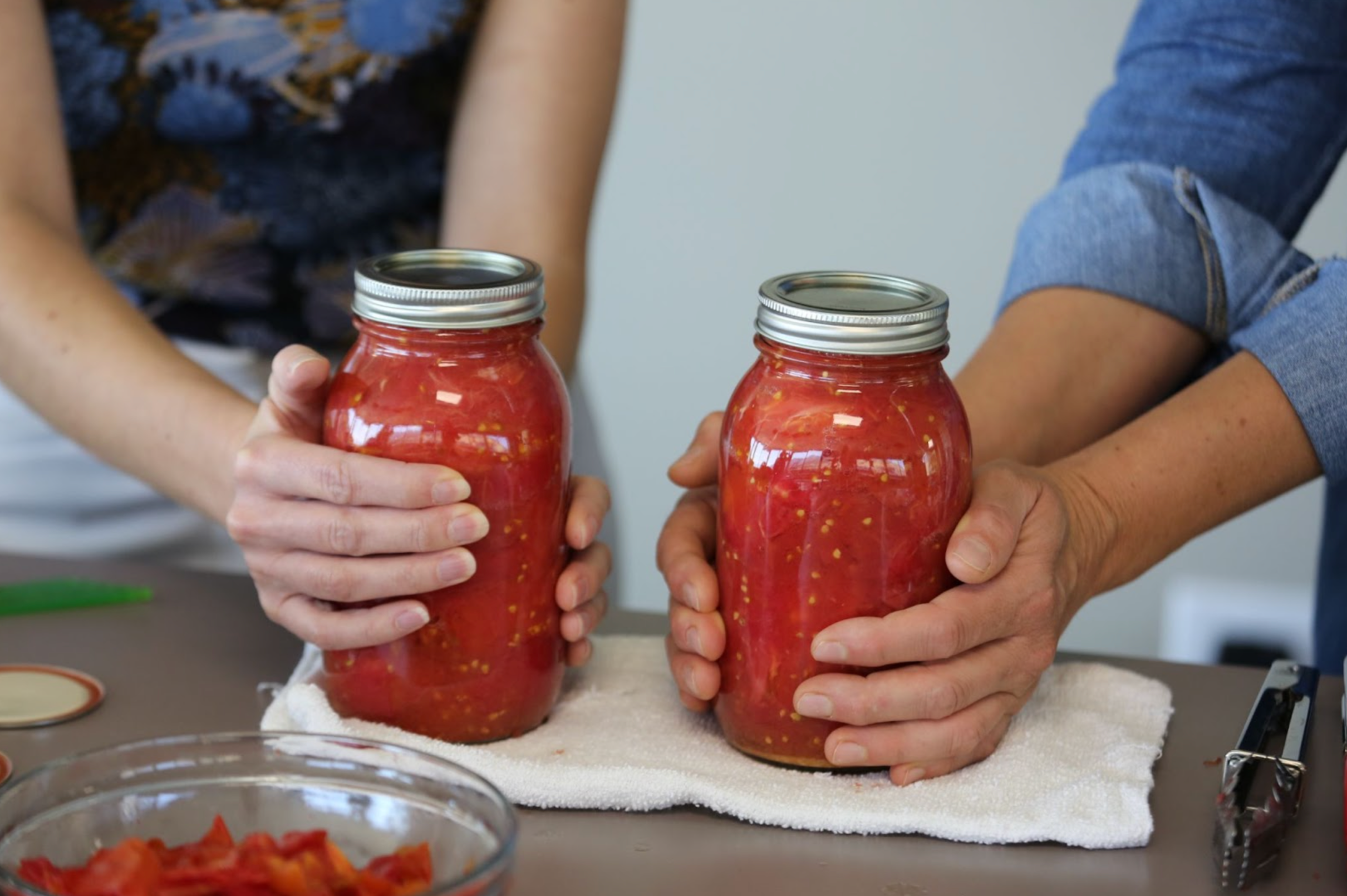 Photo of finished jars of canned tomatoes