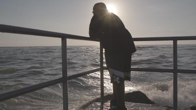 Man looking out at the ocean