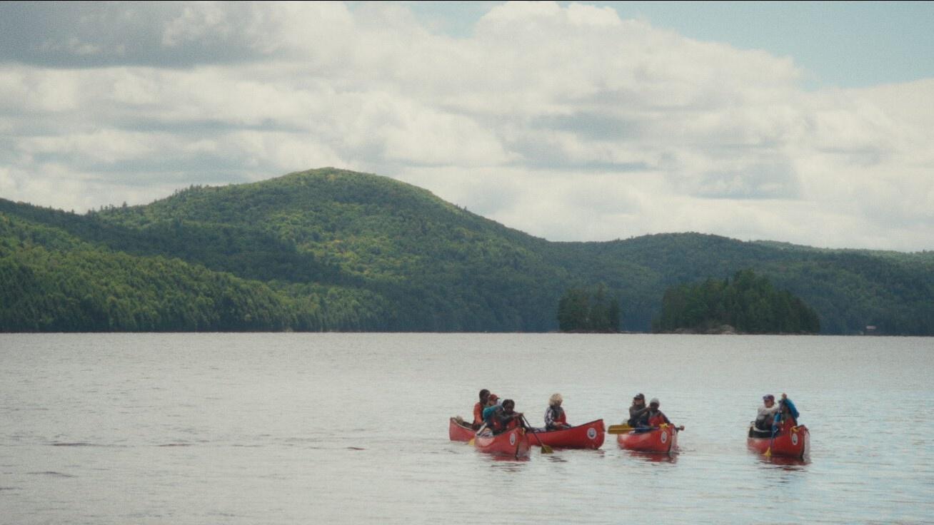 photo of kayakers on a lake
