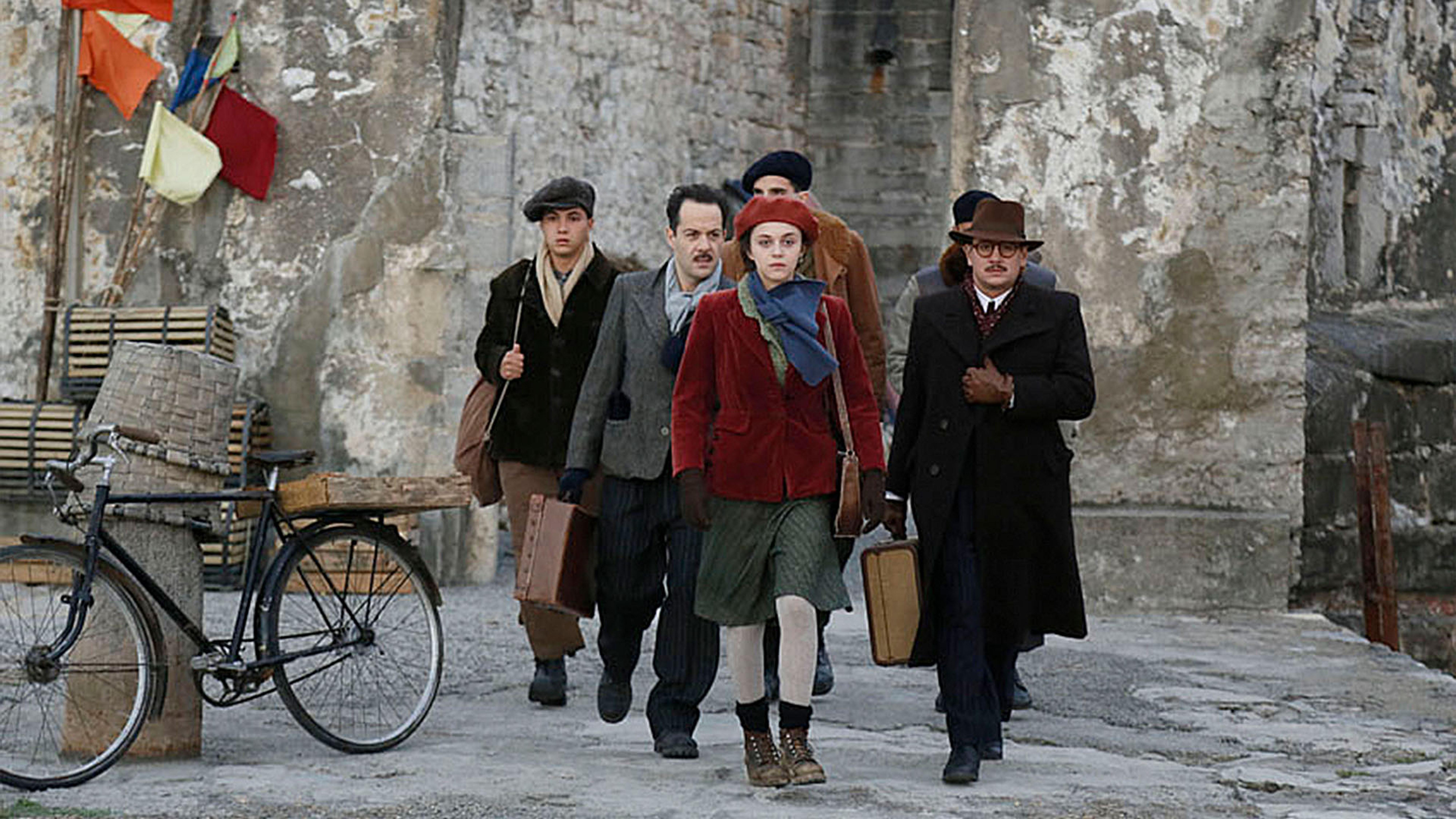 The resistance fighters walking in the street.