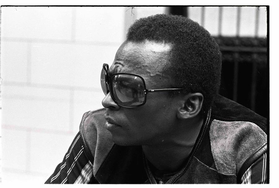 An image of Miles Davis wearing sunglasses.