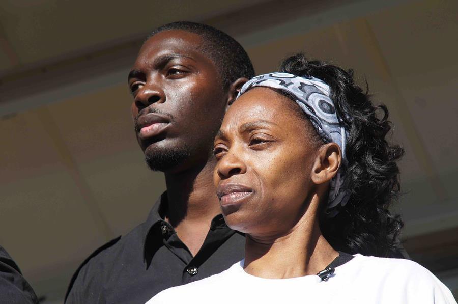 Close up of two people looking determined.