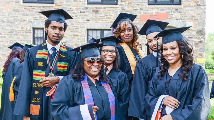 A group of smiling college graduates