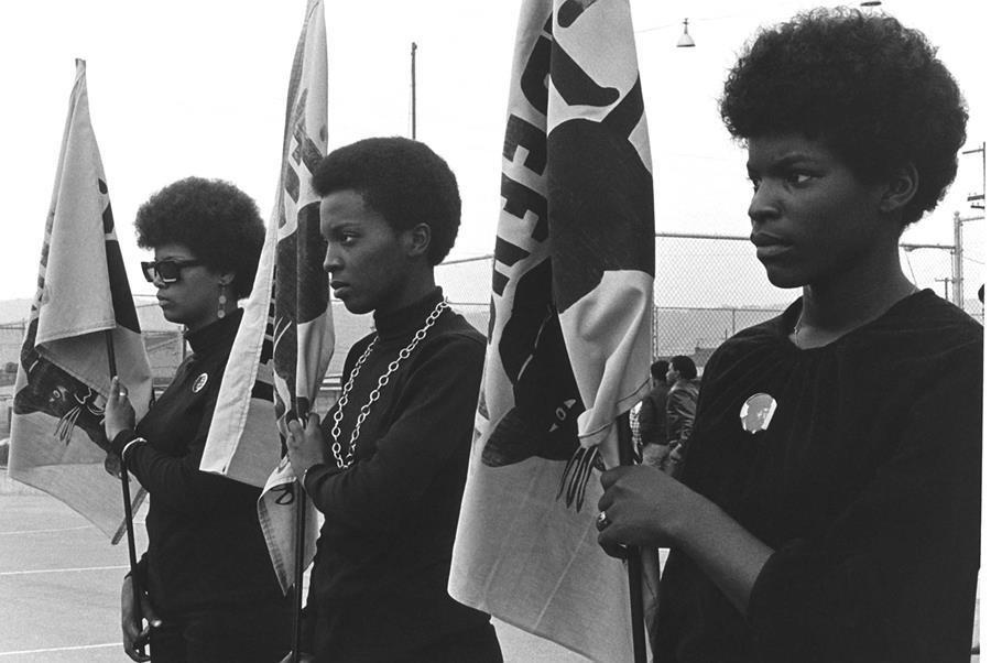 Black Panther Activists holding flags