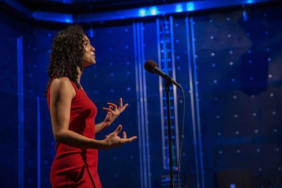 Woman speaking on stage