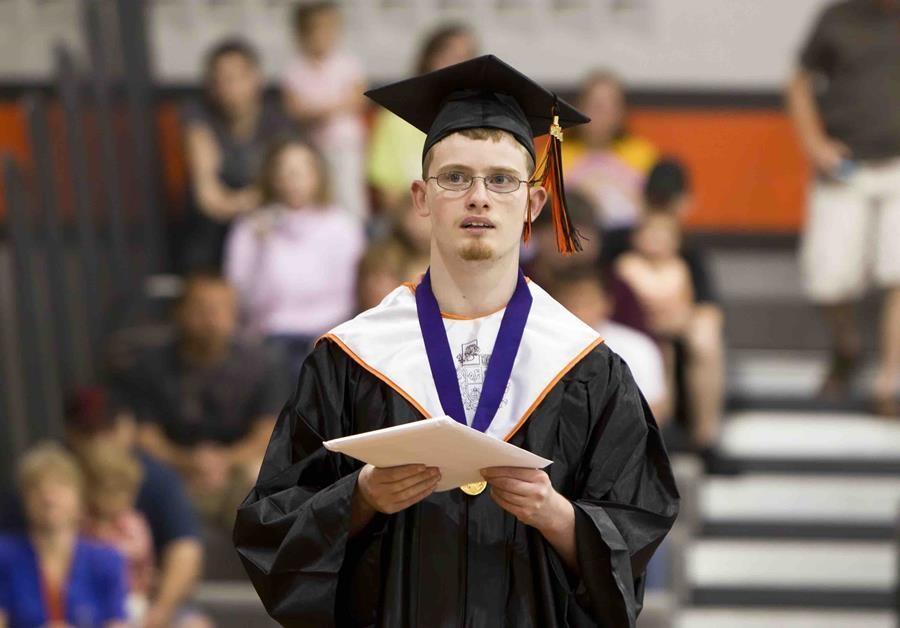 A student graduating in cap and gown.