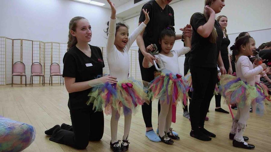 A class of young ballet dancers. 