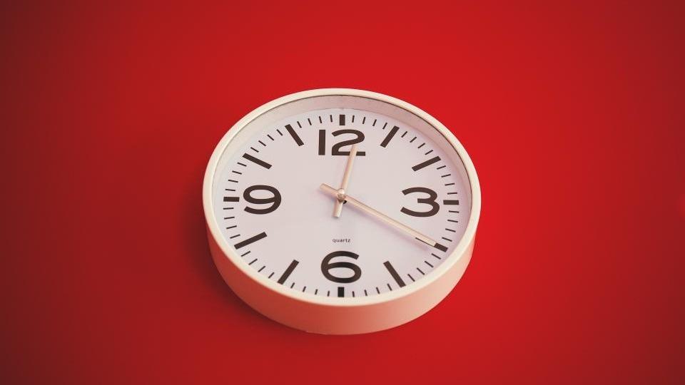 Clock on red background