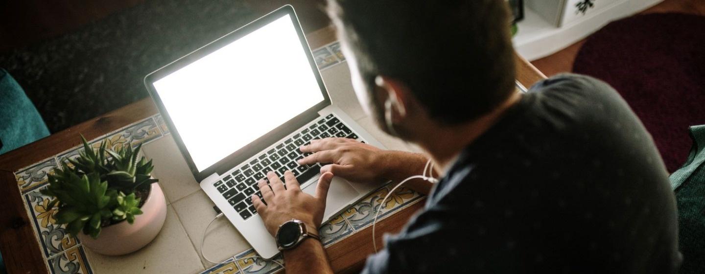 Young man working with a laptop