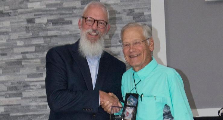 Outdoor Wisconsin Host Dan Small and Mark LaBarbera holding award