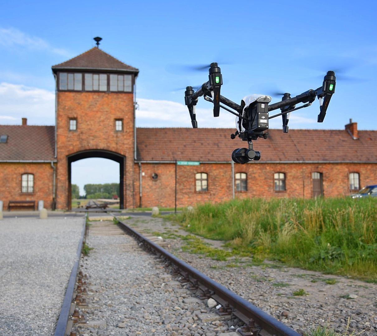 A shot of a drone filming the Eva Kor documentary at Auschwitz.