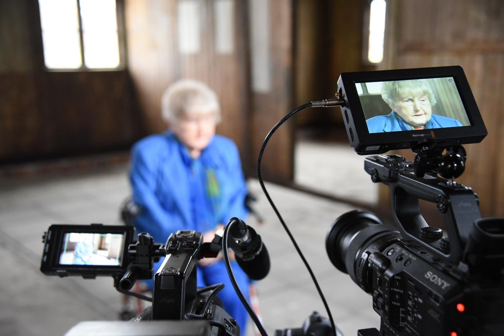 Eva Kor being interviewed at Auschwitz in the 'blood labs.'