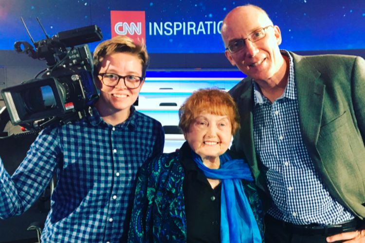 Co-Producers Ted Green and Mika Brown stand with Eva Kor at the CNN studios in London.