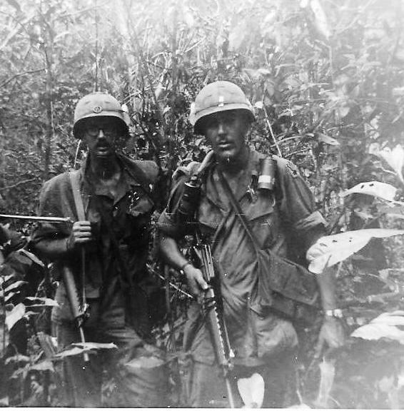 Black and white photo from Quentin Schillare or two soldiers in the jungle