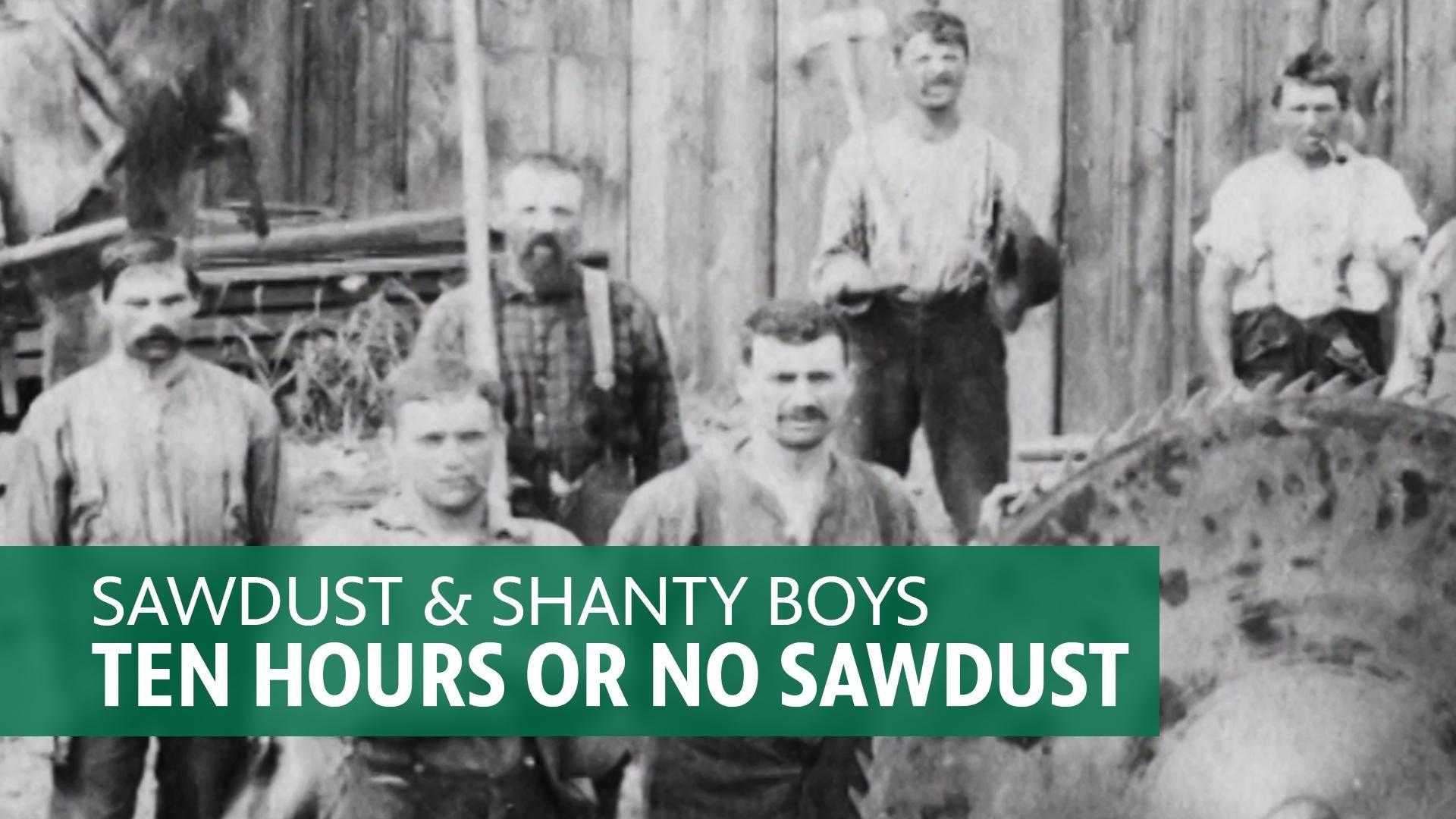 A photo from the 19th century of men outside of a sawmill next to a large saw blade made for cutting logs. A caption reads, 'Sawdust & Shanty Boys - Ten Hours or No Sawdust.'