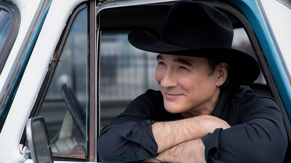 Clint Black in a truck.