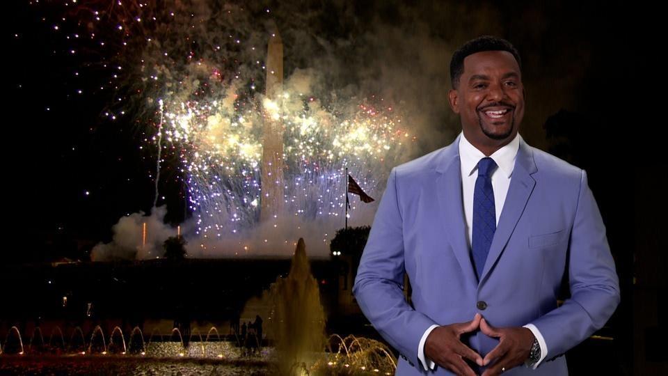 Alfonso Ribeiro in front of a fireworks show at the Washington Monument.