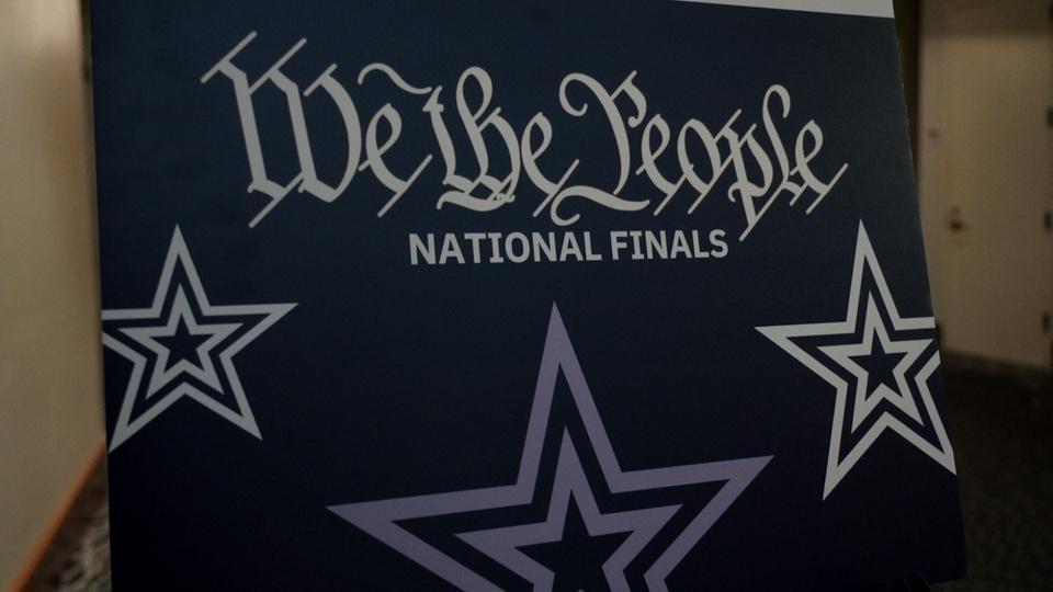 A sign that says 'We the People: National Finals.'