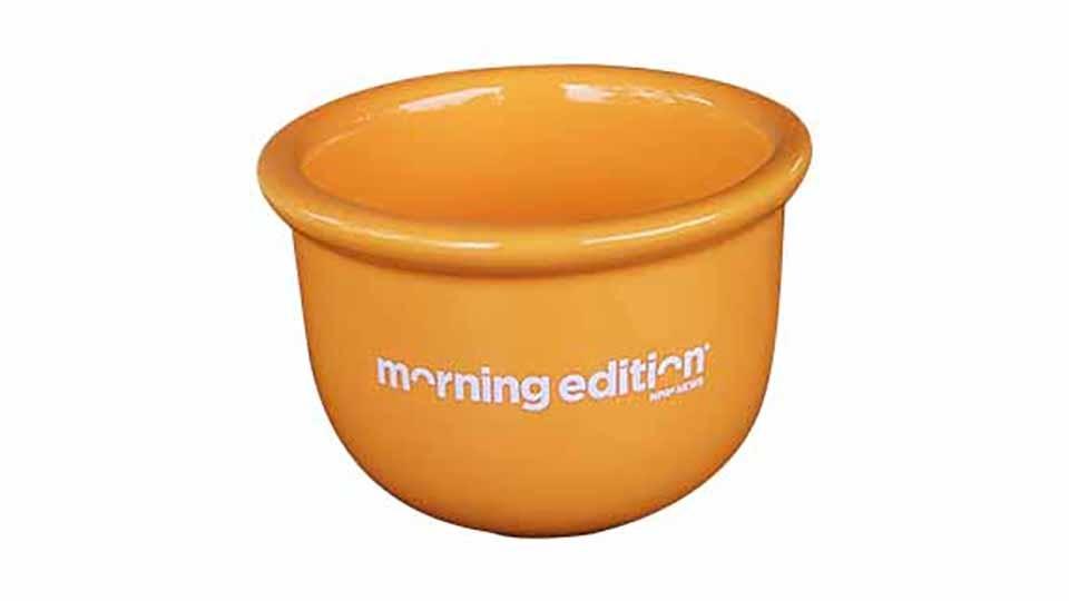 Orange cereal bowl with Morning Edition logo