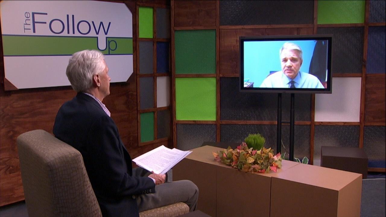 Host Mike Redford on The Follow Up set talks to Joel Strasz on a monitor.