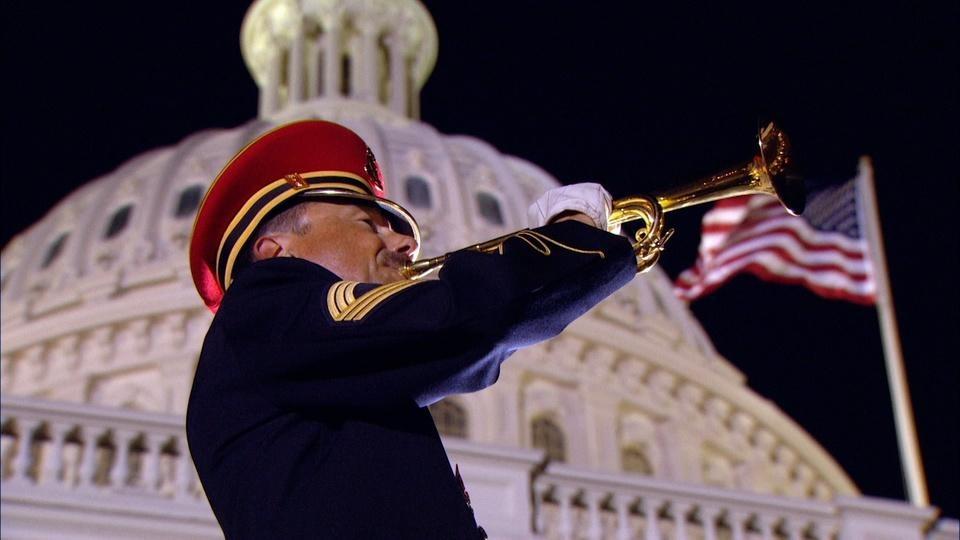 A trumpeter in front of the US Capitol.