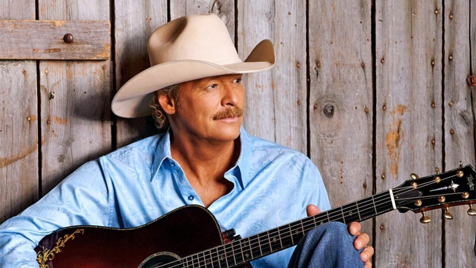 Alan Jackson with a guitar.