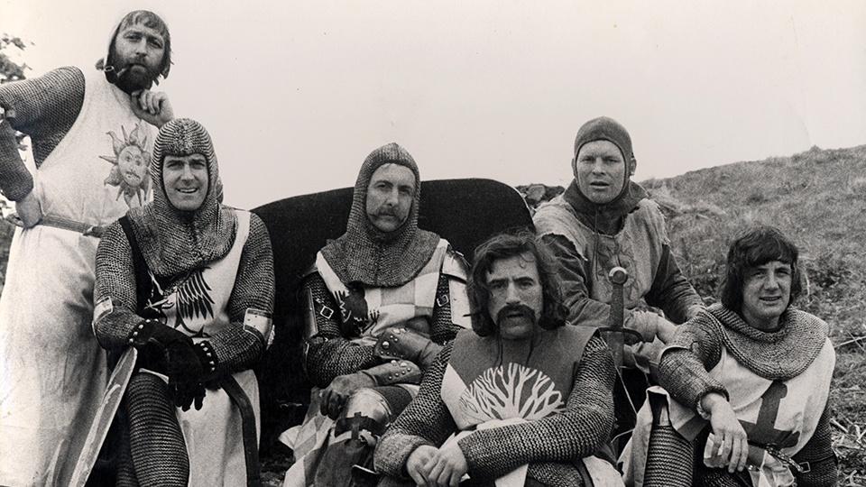 The members of Monty Python in costume on the set of Monty Python and the Holy Grail.