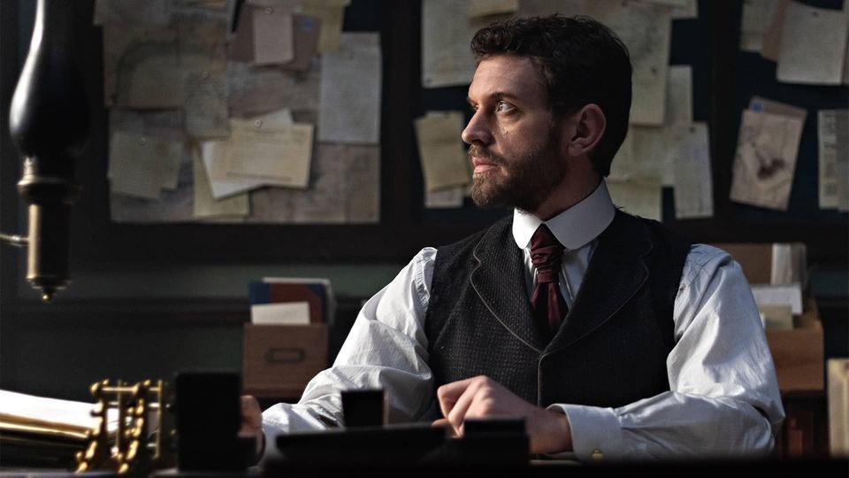 Inspector Blake at his desk.