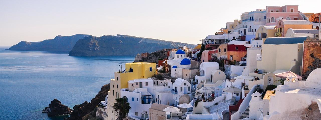 Cliffside homes overlook the sea on the island of Santorini.