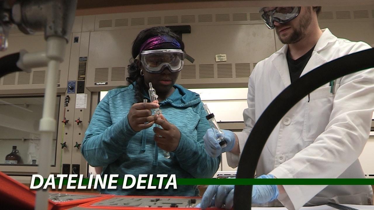 A student helps with Flint water testing.