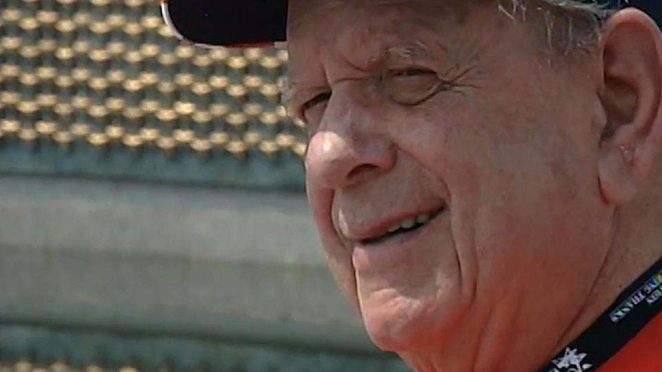 A World War II veteran in front of the WWII Memorial in Washington, DC.
