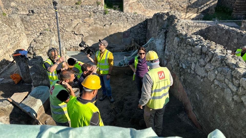 A crew digging in the ruins of Pompeii.