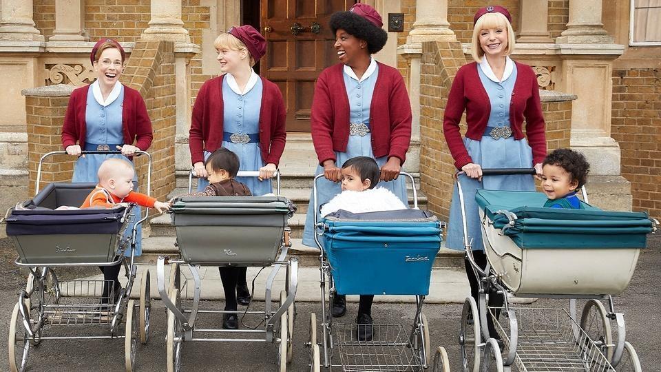 The cast of Call the Midwife push babies around in carriages.