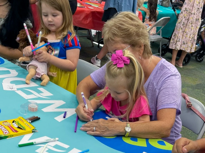 Kids learning with parents at a WEDU event