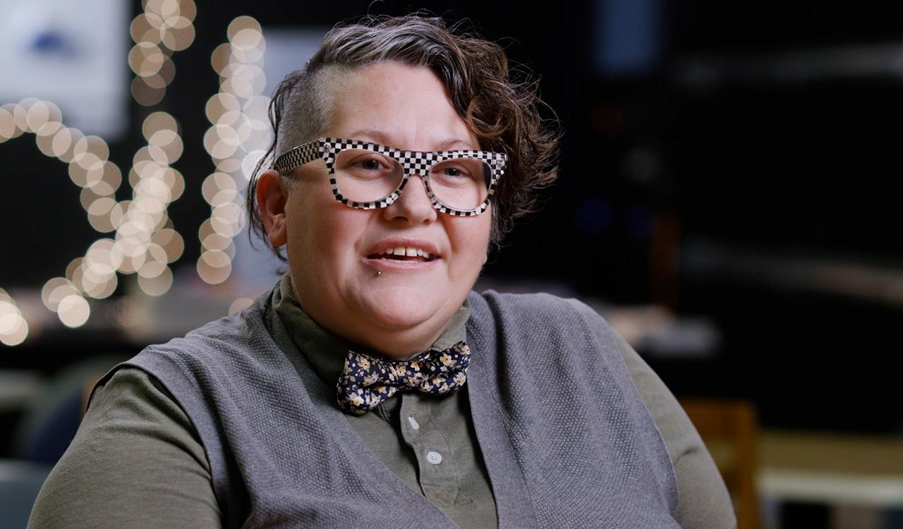 Up close portrait of an LGBTQ+ leader in a Sarasota community space