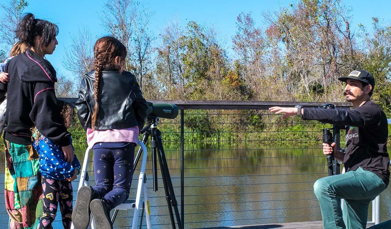 Triforce camera man setting up a shot near the water