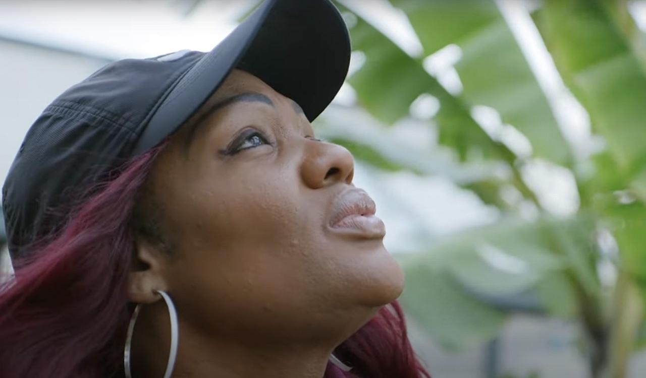 Up-close of a woman looking up at the sky at St. Pete Youth Farm