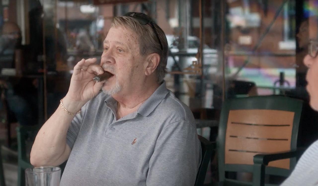 Man enjoying a cigar on the streets of Ybor City