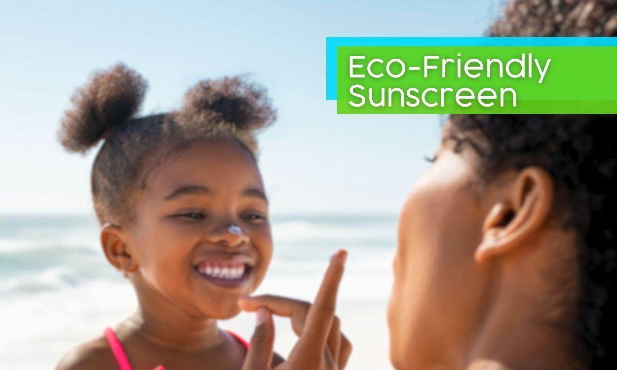 A mom applying sunscreen to the face of a child at the beach