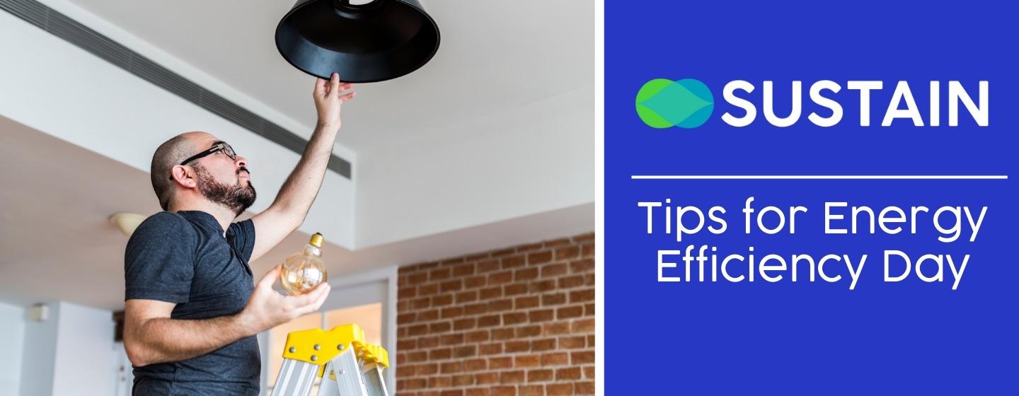 Man standing on a ladder, changing a lightbulb in an overhead fixture