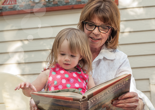 Women reading to a little girl