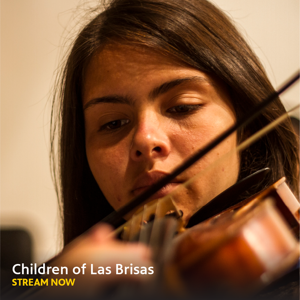 Close-up face shot of a Latina young woman playing a violin. Reads, "Children of Las Brisas Stream Now".