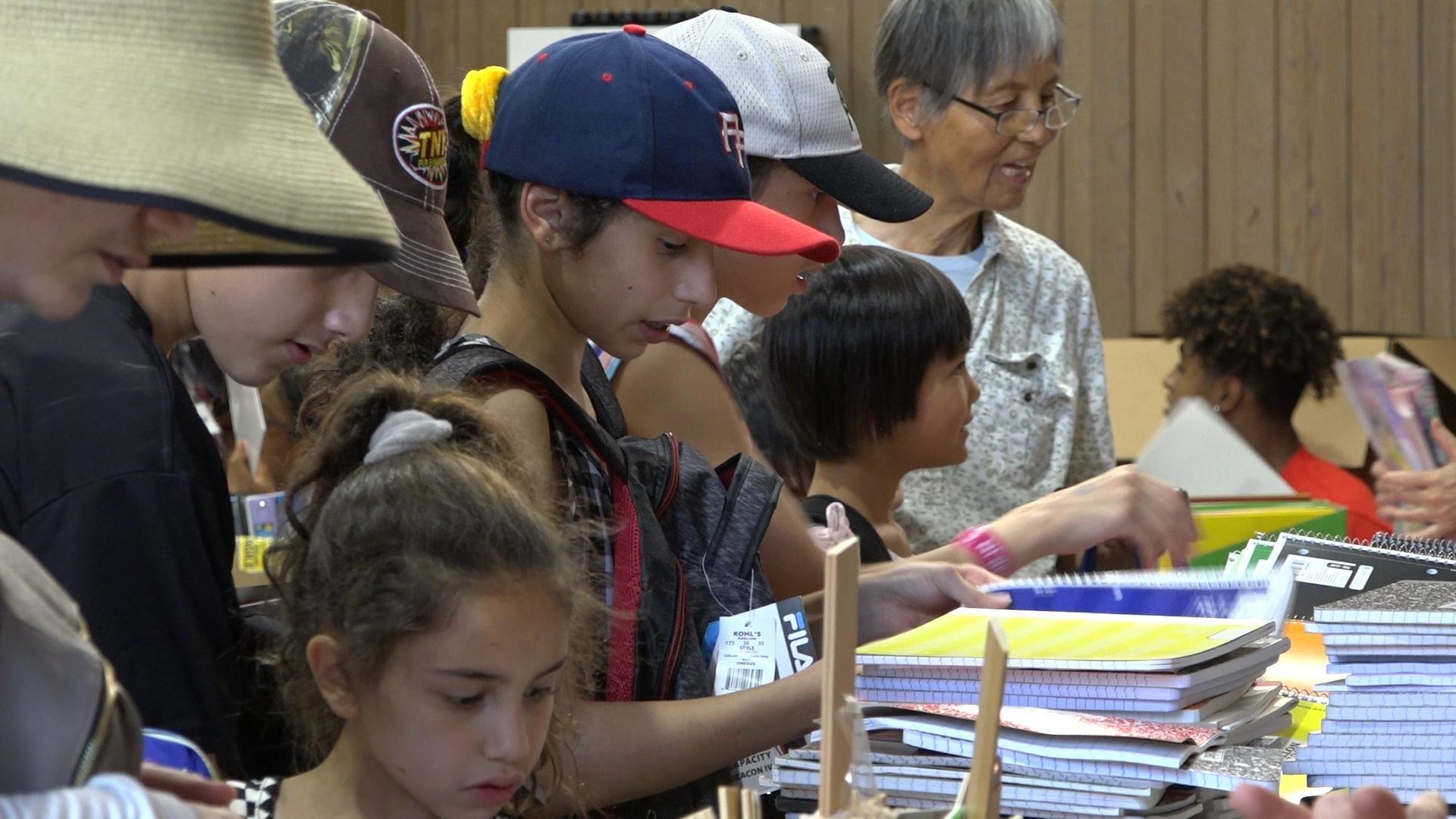 Alliance students stock up at annual backpack giveaway