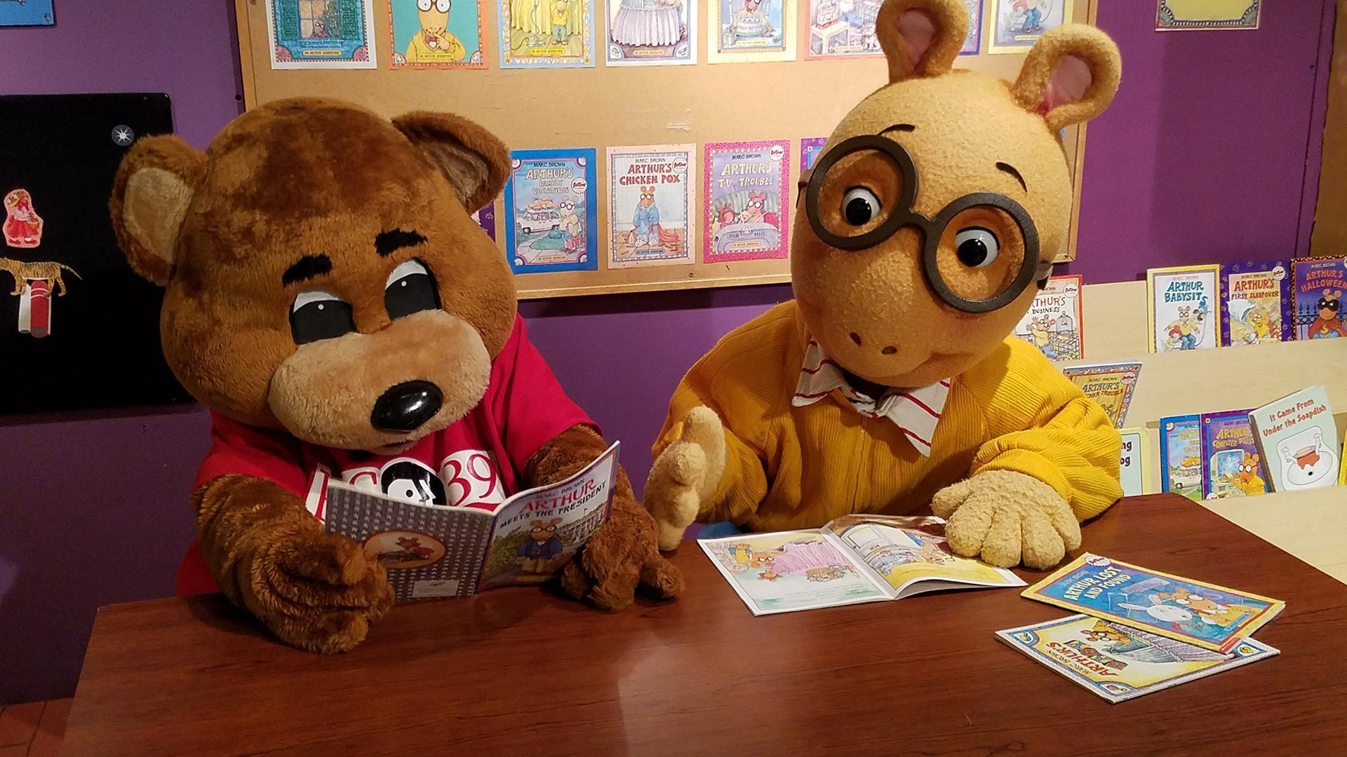 TeleBear and Arthur read a book together