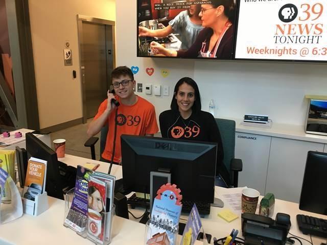 Team members at the desk during an event