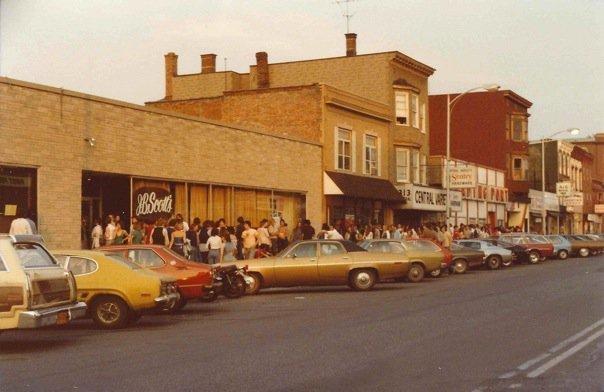 J.B. Scott's on Central Avenue with 1970s era cars parked outside and a crowd gathered in front.