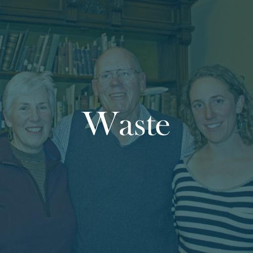 The word "waste" is displayed in white, serif, type on a dark green transparent overlay with a photo of John and his family, looking at the camera.