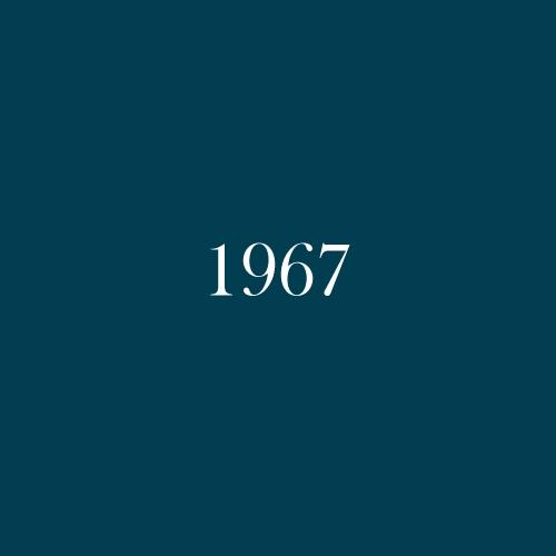 The word "1967" is displayed in white, serif, type on a dark green background.